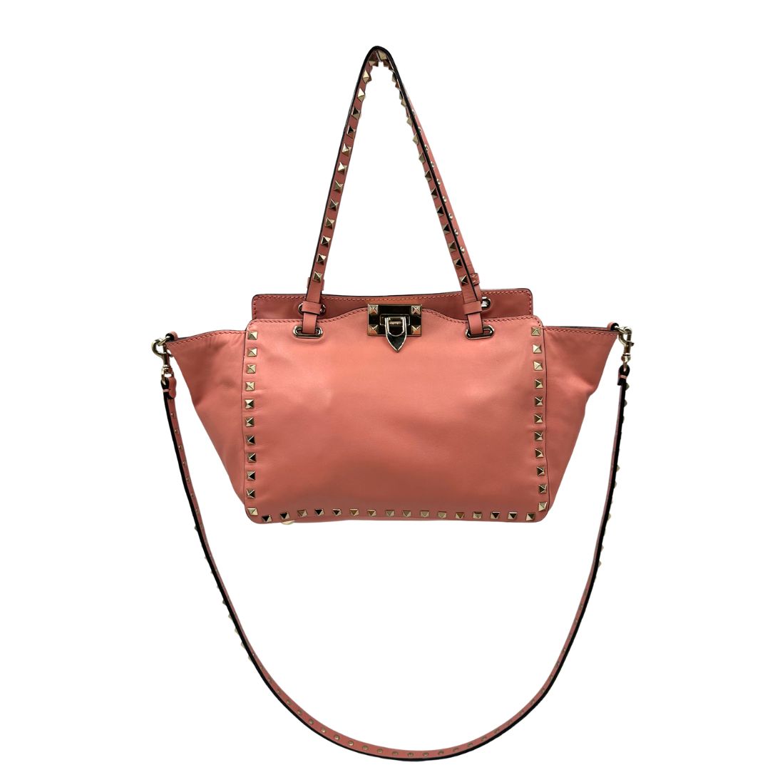 front Borsa V. G. in pelle color rosa salmone impreziosita da borchie piramidali, di lusso, originale, ottime condizioni. 