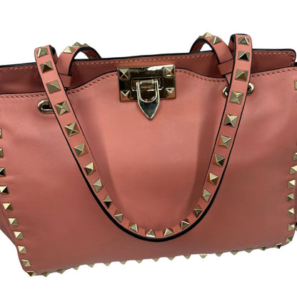 manici Borsa V. G. in pelle color rosa salmone impreziosita da borchie piramidali, di lusso, originale, ottime condizioni. 