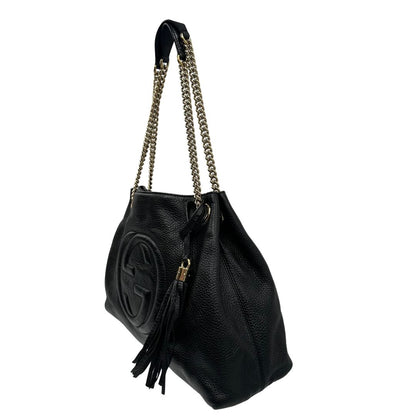 lato Borsa Gucci in pelle nera munita di doppi manici, indossabile a spalla, di lusso, originale, ottime condizioni, usata. 