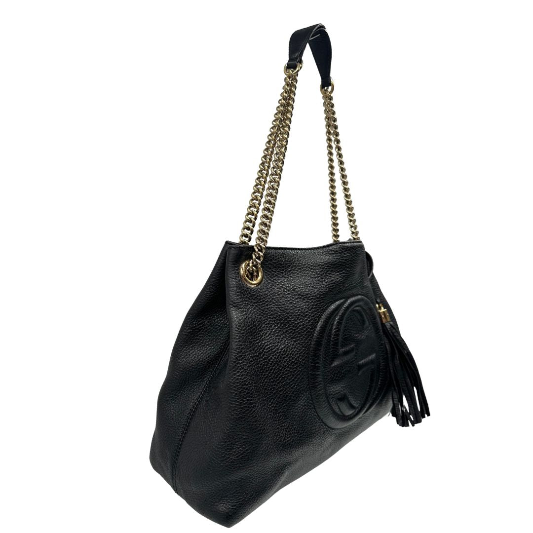 lato Borsa Gucci in pelle nera munita di doppi manici, indossabile a spalla, di lusso, originale, ottime condizioni, usata. 