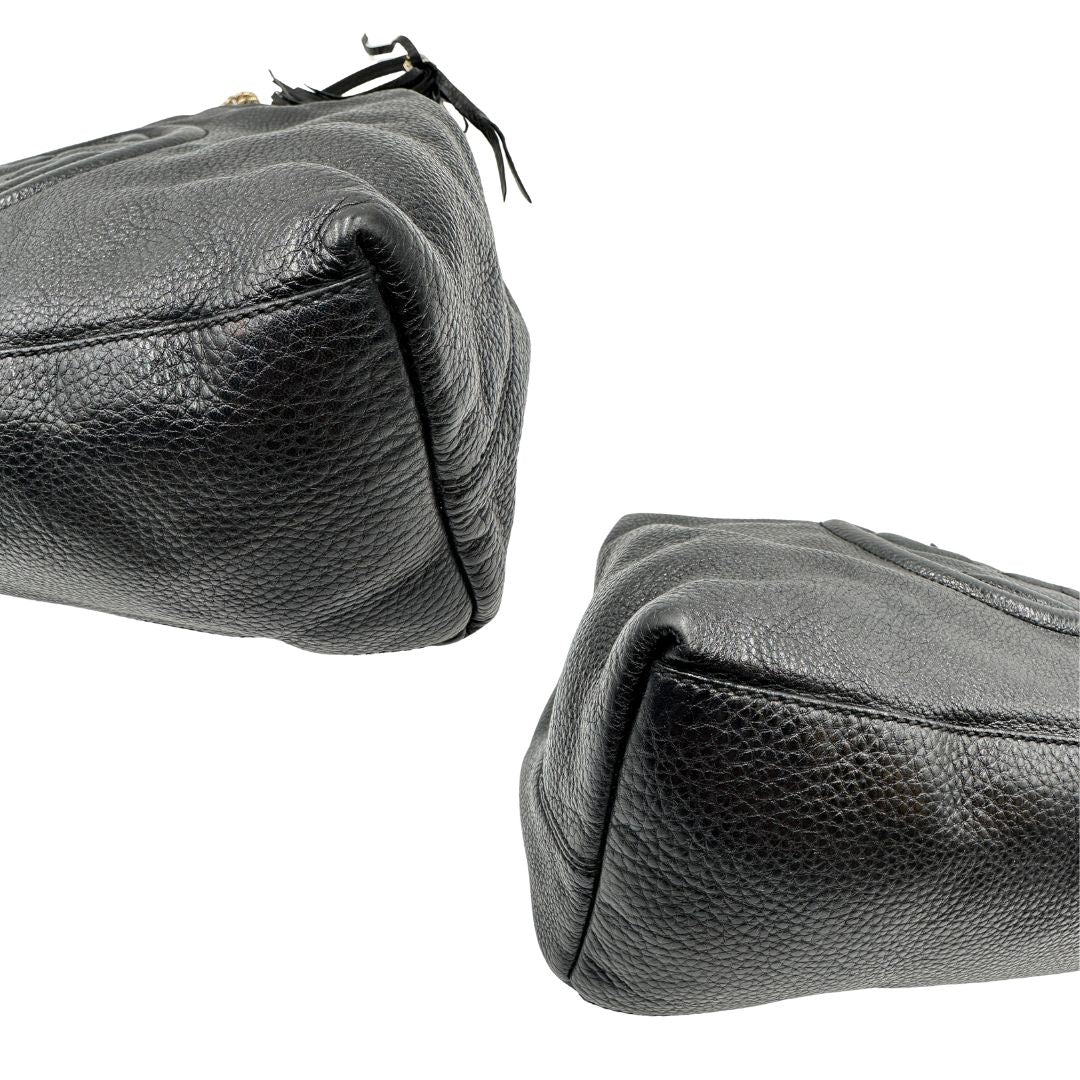 angoli Borsa Gucci in pelle nera munita di doppi manici, indossabile a spalla, di lusso, originale, ottime condizioni, usata. 