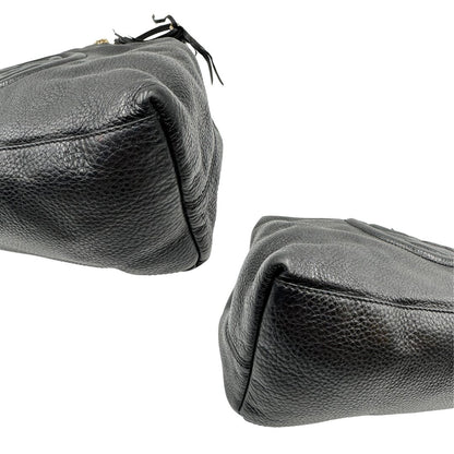 angoli Borsa Gucci in pelle nera munita di doppi manici, indossabile a spalla, di lusso, originale, ottime condizioni, usata. 
