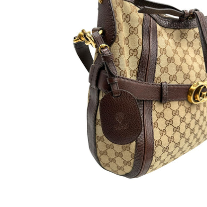 angolo  Borsa Gucci in tessuto GG e finiture in pelle marrone, di lusso, originale, ottime condizioni, usata. 