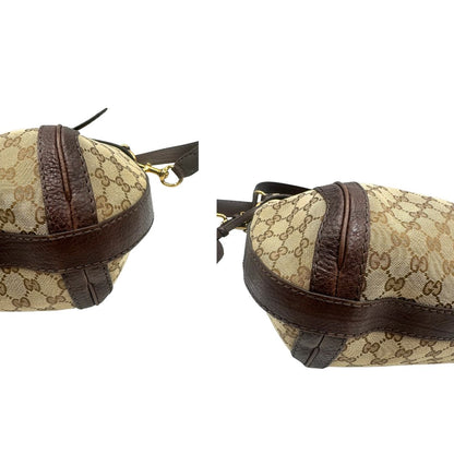 angoli  Borsa Gucci in tessuto GG e finiture in pelle marrone, di lusso, originale, ottime condizioni, usata. 