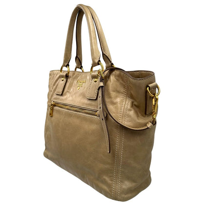 lato Borsa Prada in pelle beige, indossabile anche a tracolla, di lusso, originale, ottime condizioni, usata. 