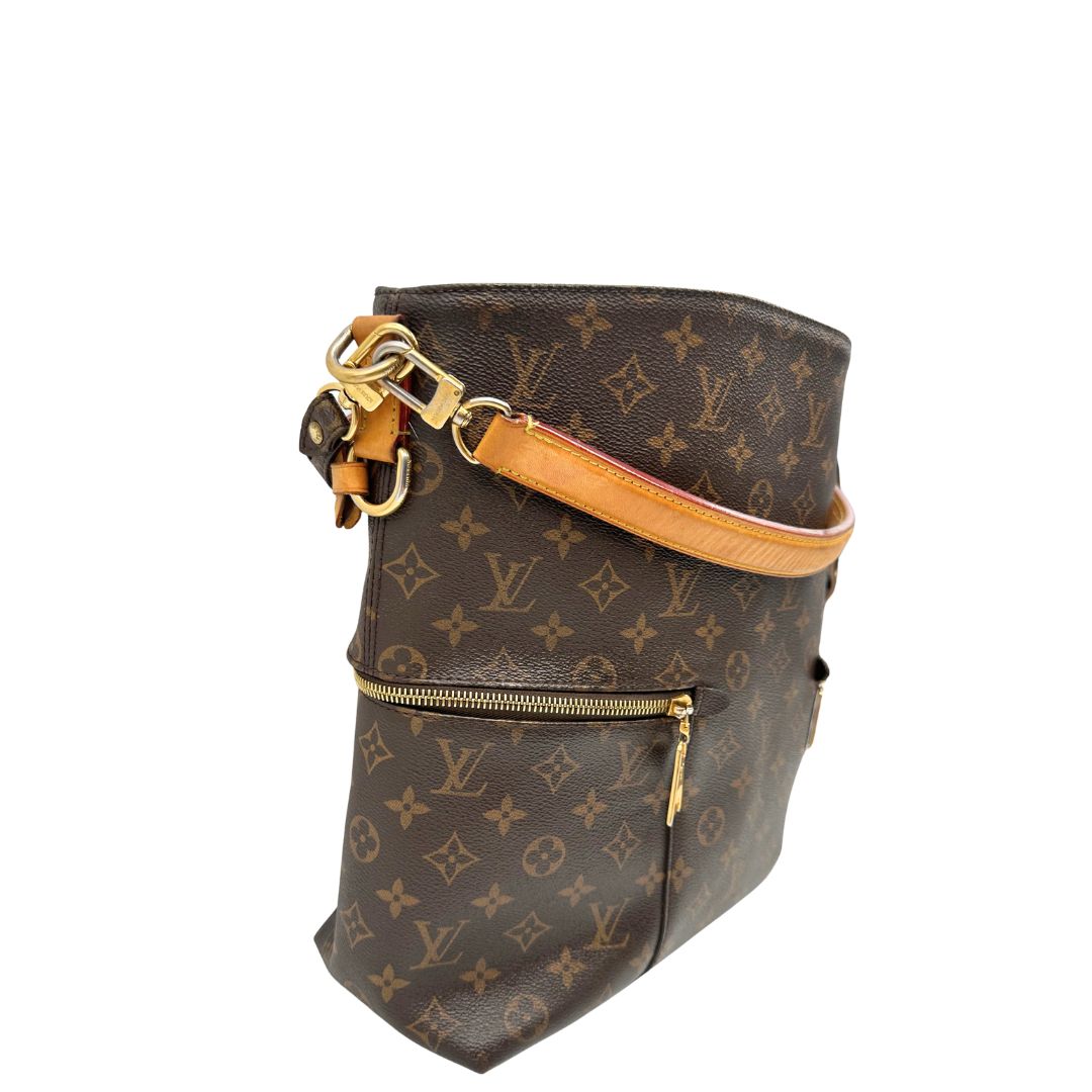 lato Borsa Mélie LV in canvas monogram, munita di un manico singolo e una tracolla amovibile e regolabile, di lusso, originale, ottime condizioni, usata. 