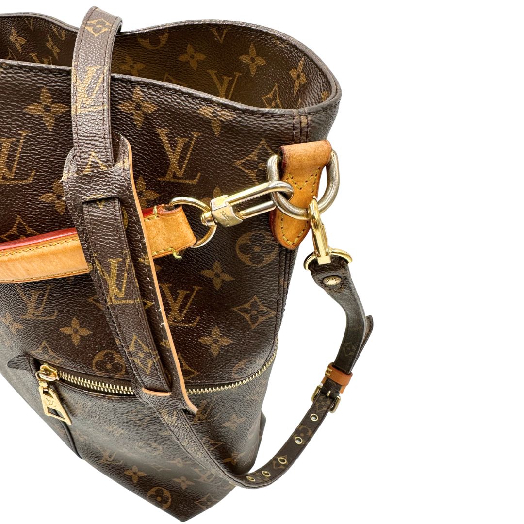 lato Borsa Mélie LV in canvas monogram, munita di un manico singolo e una tracolla amovibile e regolabile, di lusso, originale, ottime condizioni, usata. 