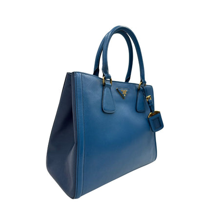 lato Borsa Prada in pelle saffiano in doppia tonalità di blu, munita di doppi manici, di lusso, originale, ottime condizioni. 