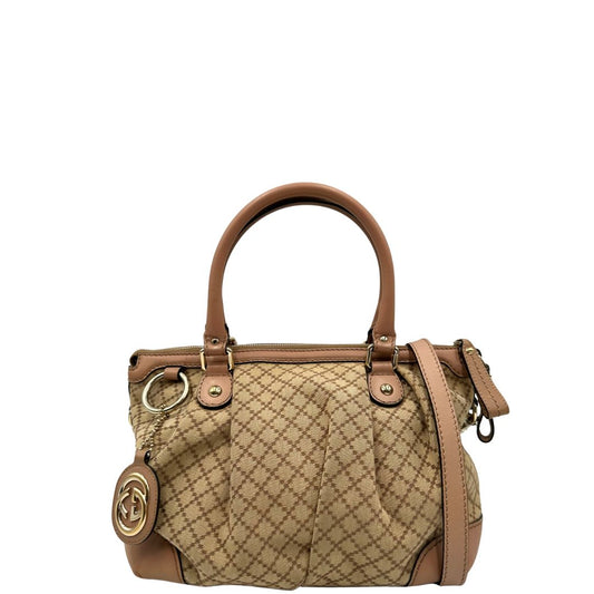 front Borsa Gucci Diamante in tessuto beige con finiture in pelle rosa, munita di doppi manici e una tracolla amovibile e regolabile, di lusso, originale, ottime condizioni, usata. 