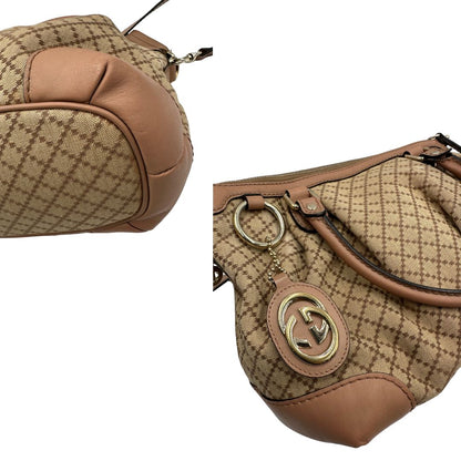 angoli Borsa Gucci Diamante in tessuto beige con finiture in pelle rosa, munita di doppi manici e una tracolla amovibile e regolabile, di lusso, originale, ottime condizioni, usata. 