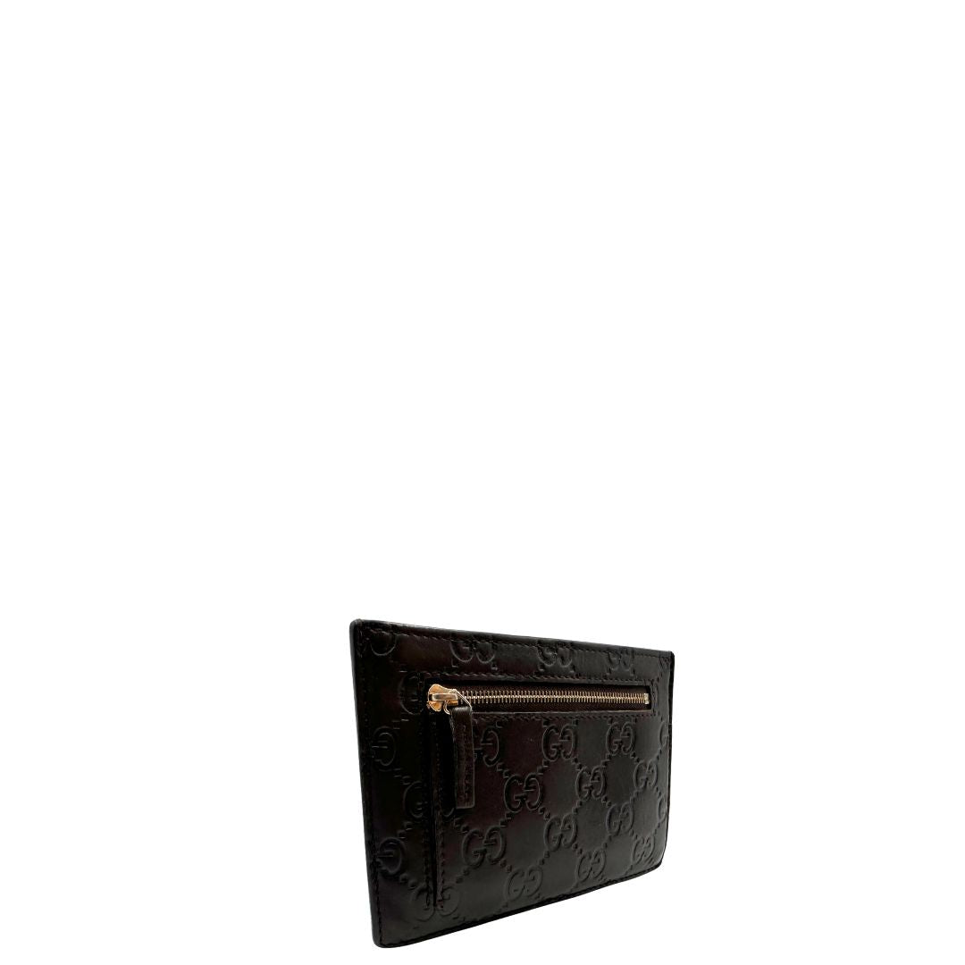 lato  Portacarte Gucci in pelle marrone trama Guccissima, di lusso, originale, ottime condizioni, usato. 