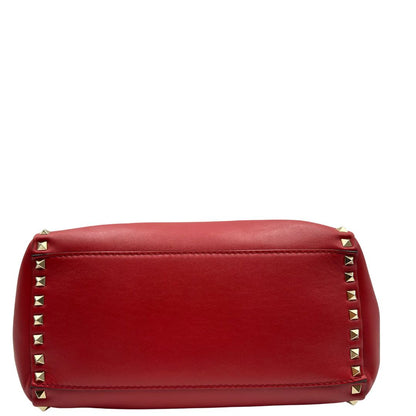 Borsa V. G. in pelle rossa impreziosita da borchie piramidali dorate, di lusso, originale, ottime condizioni, usata.