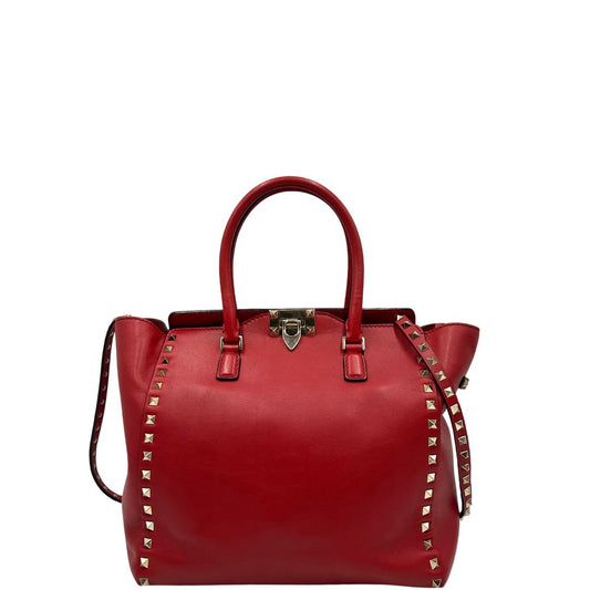 front Borsa V. G. in pelle rossa impreziosita da borchie piramidali dorate, di lusso, originale, ottime condizioni, usata. 