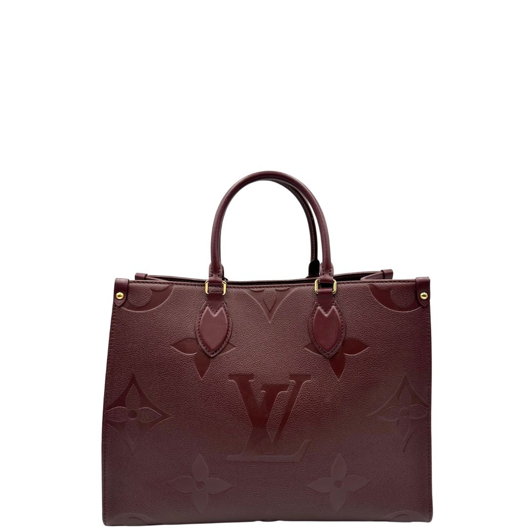 front  Louis Vuitton OnTheGo nella versione MM in pelle monogram Empreinte color bordeaux, di lusso, originale, ottime condizioni, usata. 