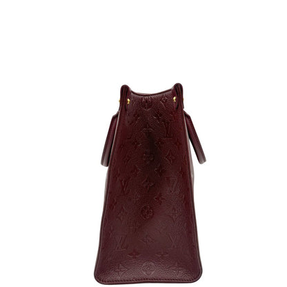 lato  Louis Vuitton OnTheGo nella versione MM in pelle monogram Empreinte color bordeaux, di lusso, originale, ottime condizioni, usata. 
