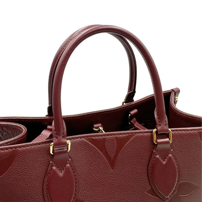 manici  Louis Vuitton OnTheGo nella versione MM in pelle monogram Empreinte color bordeaux, di lusso, originale, ottime condizioni, usata. 