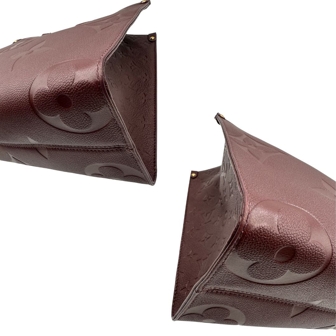 angoli  Louis Vuitton OnTheGo nella versione MM in pelle monogram Empreinte color bordeaux, di lusso, originale, ottime condizioni, usata. 