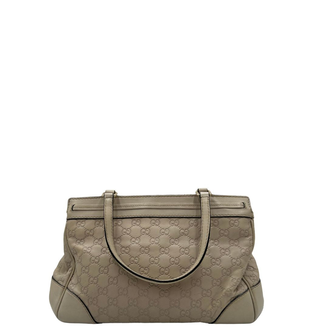 retro Borsa Gucci in pelle color bianco latte GG munita di doppi manici, di lusso, originale, ottime condizioni, usata 