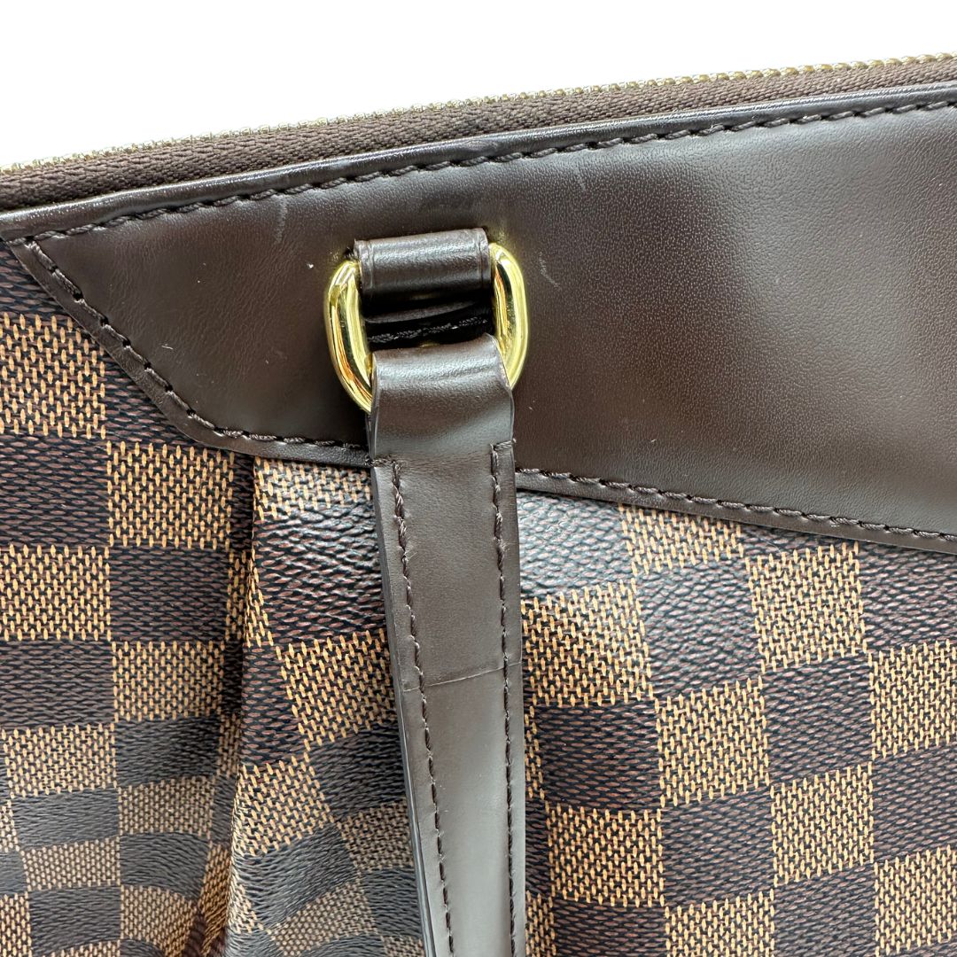 Borsa Louis Vuitton in canvas Damier Ébène con finiture in pelle marrone e dettagli hardware dorati, di lusso, originale, ottime condizioni, usata.