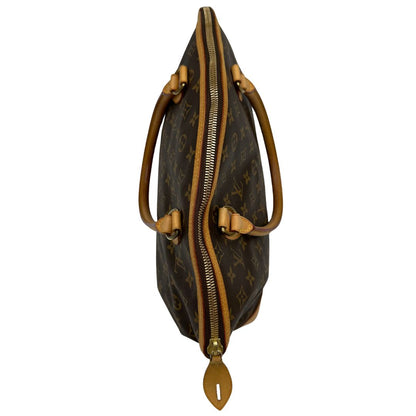 Borsa Louis Vuitton in tela Monogram con finiture in vacchetta naturale e dettagli hardware dorati. Design elegante, da portare a spalla, di lusso, originale, ottime condizioni, usata.