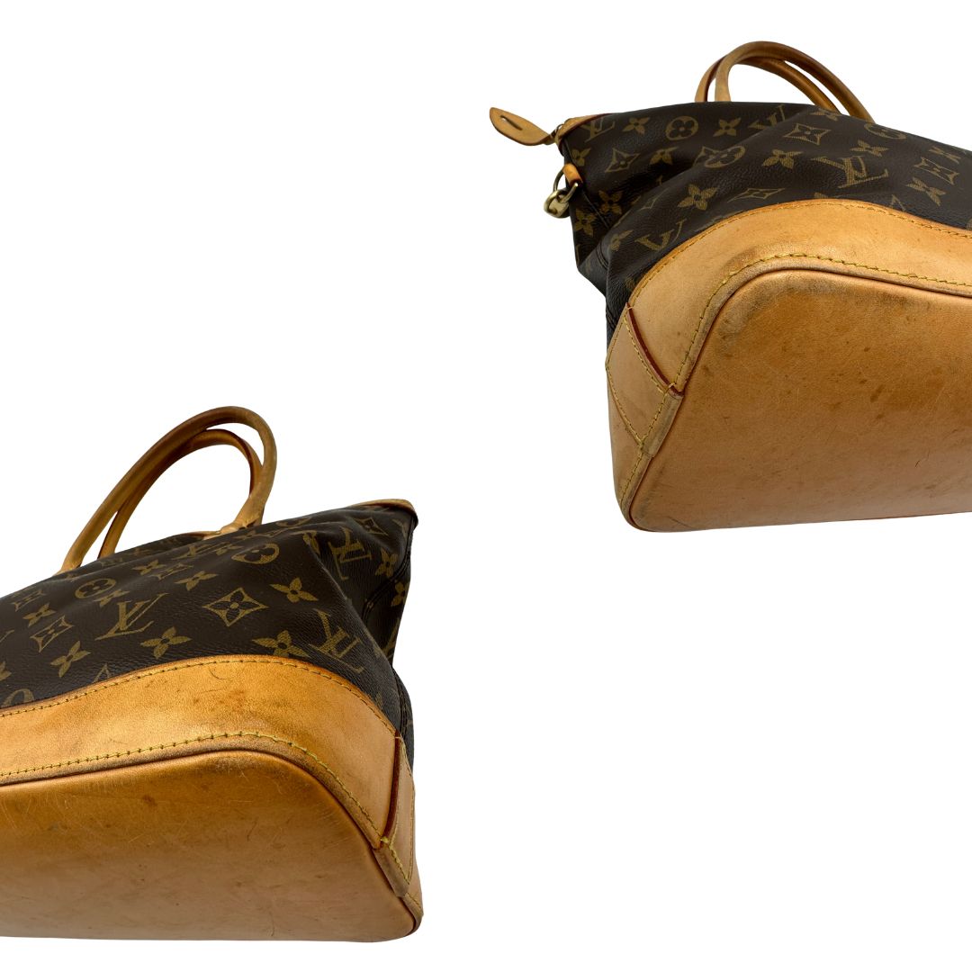 angoli Borsa Louis Vuitton in tela Monogram con finiture in vacchetta naturale e dettagli hardware dorati. Design elegante, da portare a spalla, di lusso, originale, ottime condizioni, usata. 