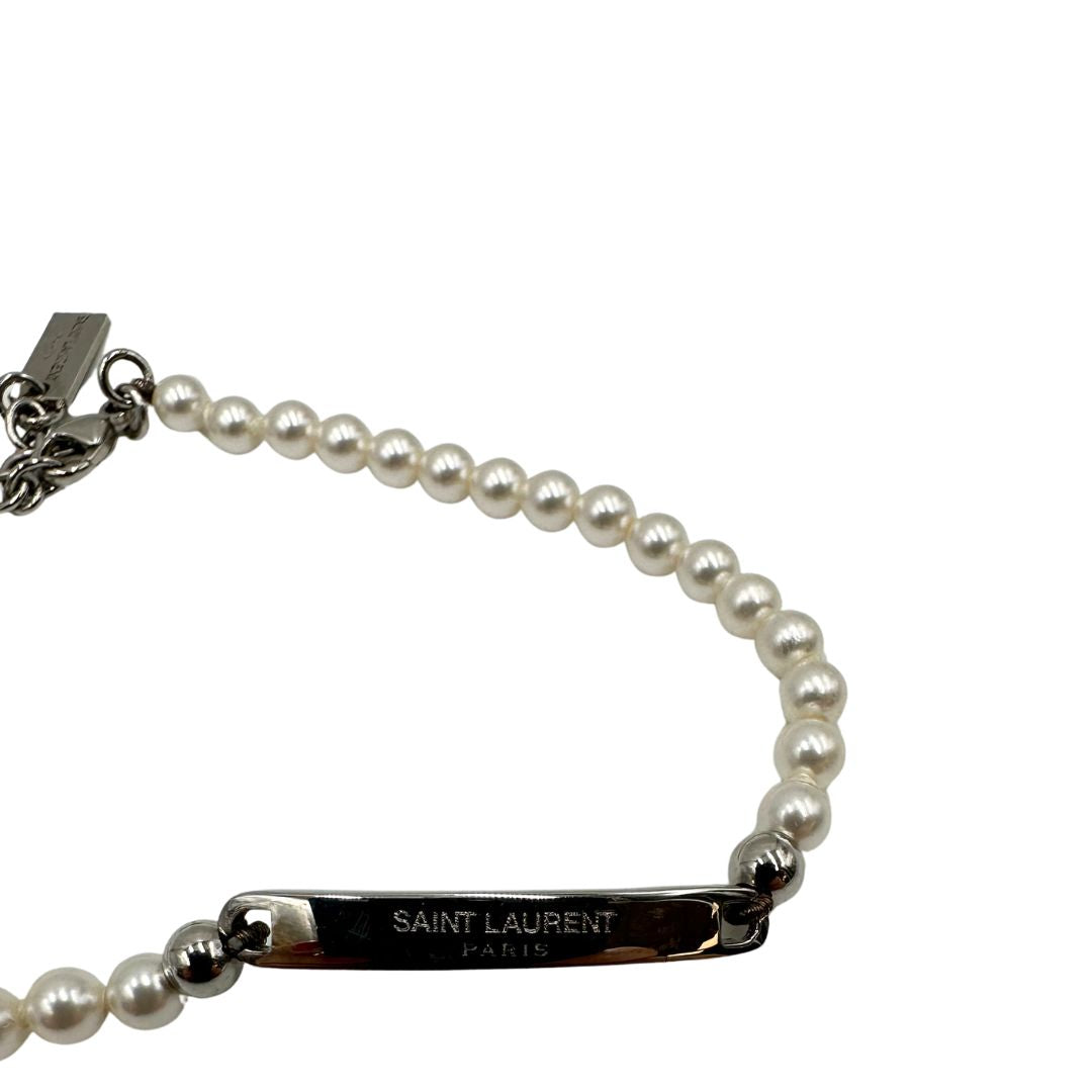 Bracciale Saint Laurent in metallo argentato e perline sintetiche, di lusso, originale, ottime condizioni.