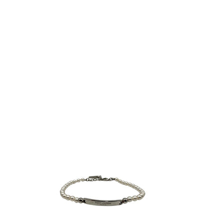 Bracciale Saint Laurent in metallo argentato e perline sintetiche, di lusso, originale, ottime condizioni.