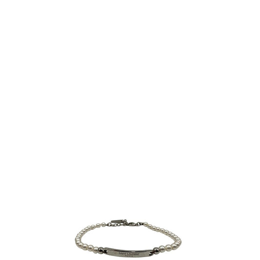 Bracciale Saint Laurent in metallo argentato e perline sintetiche, di lusso, originale, ottime condizioni.