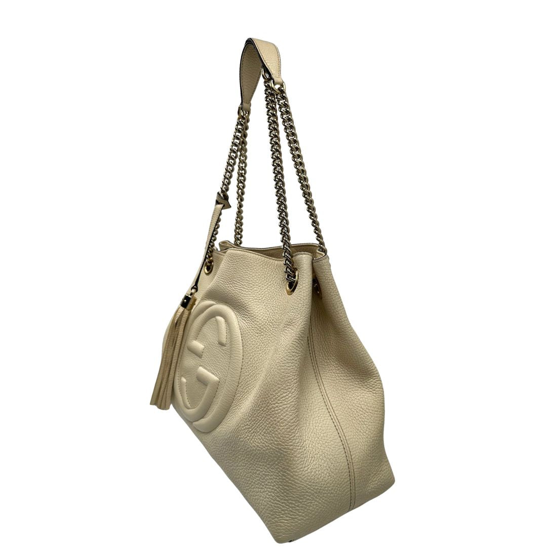 lato Borsa Gucci in pelle color bianco avorio munita di doppi manici, indossabile a spalla, di lusso, originale, ottime condizioni, usata. 