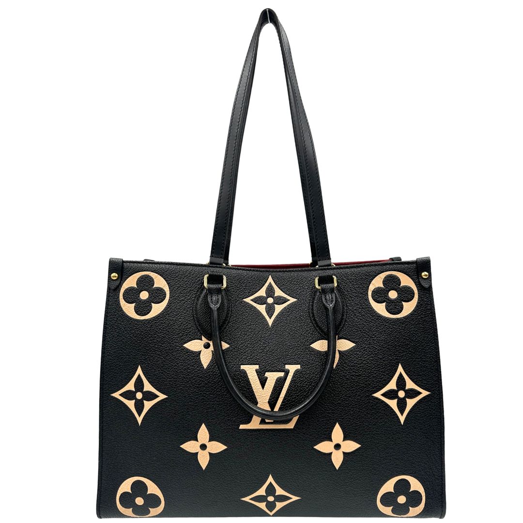 front Louis Vuitton OnTheGo nella versione MM in pelle monogram Empreinte bicolor, nera e color crema, di lusso, originale, ottime condizioni, usata. 