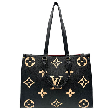 front Louis Vuitton OnTheGo nella versione MM in pelle monogram Empreinte bicolor, nera e color crema, di lusso, originale, ottime condizioni, usata. 