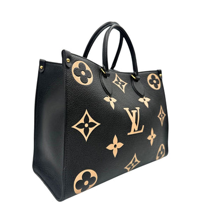lato Louis Vuitton OnTheGo nella versione MM in pelle monogram Empreinte bicolor, nera e color crema, di lusso, originale, ottime condizioni, usata. 