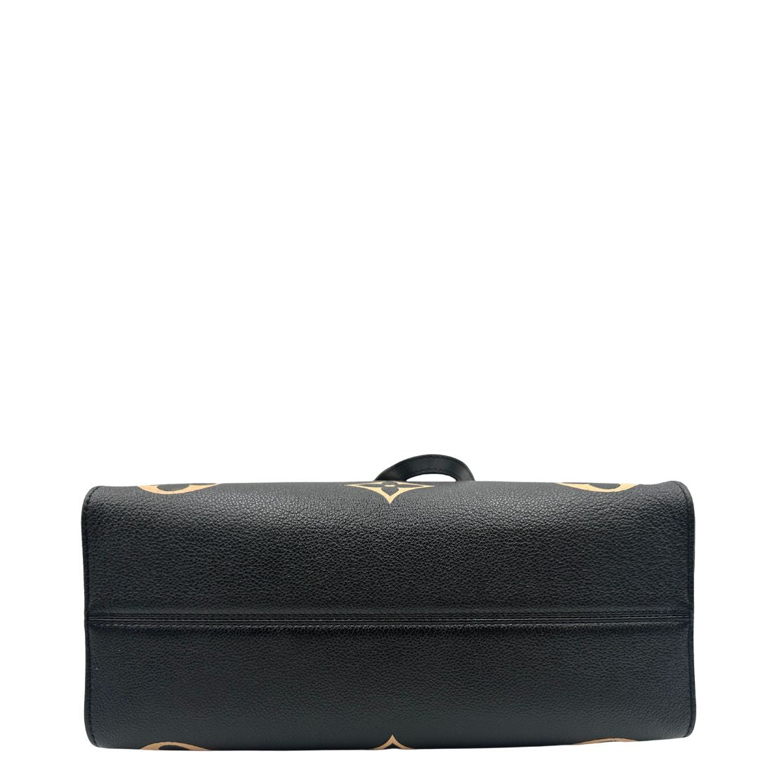 base Louis Vuitton OnTheGo nella versione MM in pelle monogram Empreinte bicolor, nera e color crema, di lusso, originale, ottime condizioni, usata. 