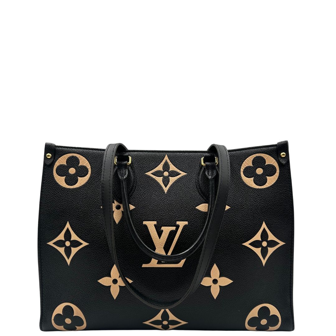 retro Louis Vuitton OnTheGo nella versione MM in pelle monogram Empreinte bicolor, nera e color crema, di lusso, originale, ottime condizioni, usata. 
