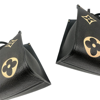 angoli Louis Vuitton OnTheGo nella versione MM in pelle monogram Empreinte bicolor, nera e color crema, di lusso, originale, ottime condizioni, usata. 