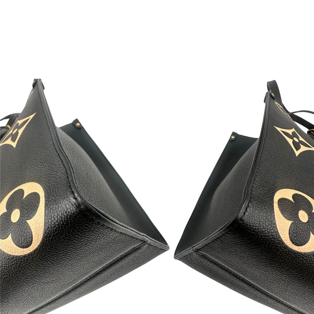 angoli Louis Vuitton OnTheGo nella versione MM in pelle monogram Empreinte bicolor, nera e color crema, di lusso, originale, ottime condizioni, usata. 
