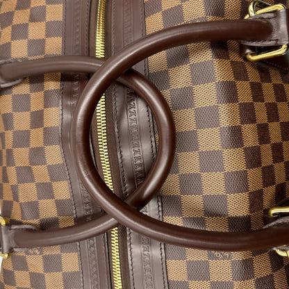 manici  Borsone Louis Vuitton in canvas Damier Ébène con finiture in pelle marrone e dettagli hardware dorati, di lusso, originale, ottime condizioni, usato. 