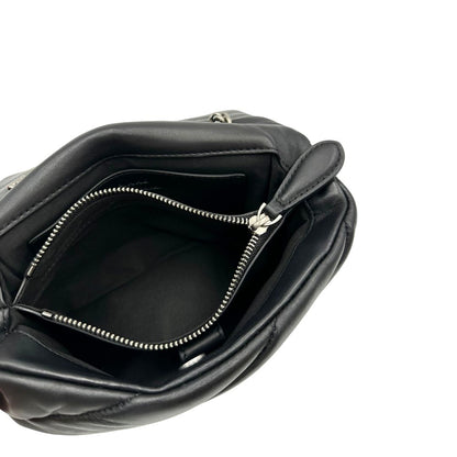 Interno, Borsa Love Bag Puff nella versione piccola in morbida nappa nera con maxi trapuntatura obliqua, hardware argentato. Indossabile a spalla oppure a tracolla. Originale, usata, di lusso, in ottime condizioni.