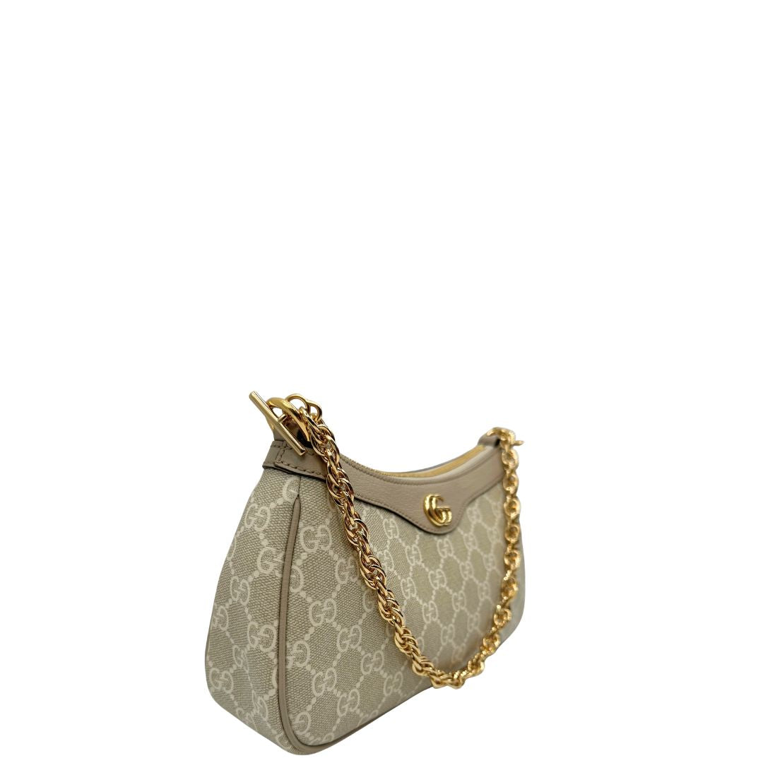 lato Borsa Gucci realizzata in canvas GG Supreme color sabbia con finiture in pelle beige e hardware dorato, di lusso, originale, eccellenti condizioni. 
