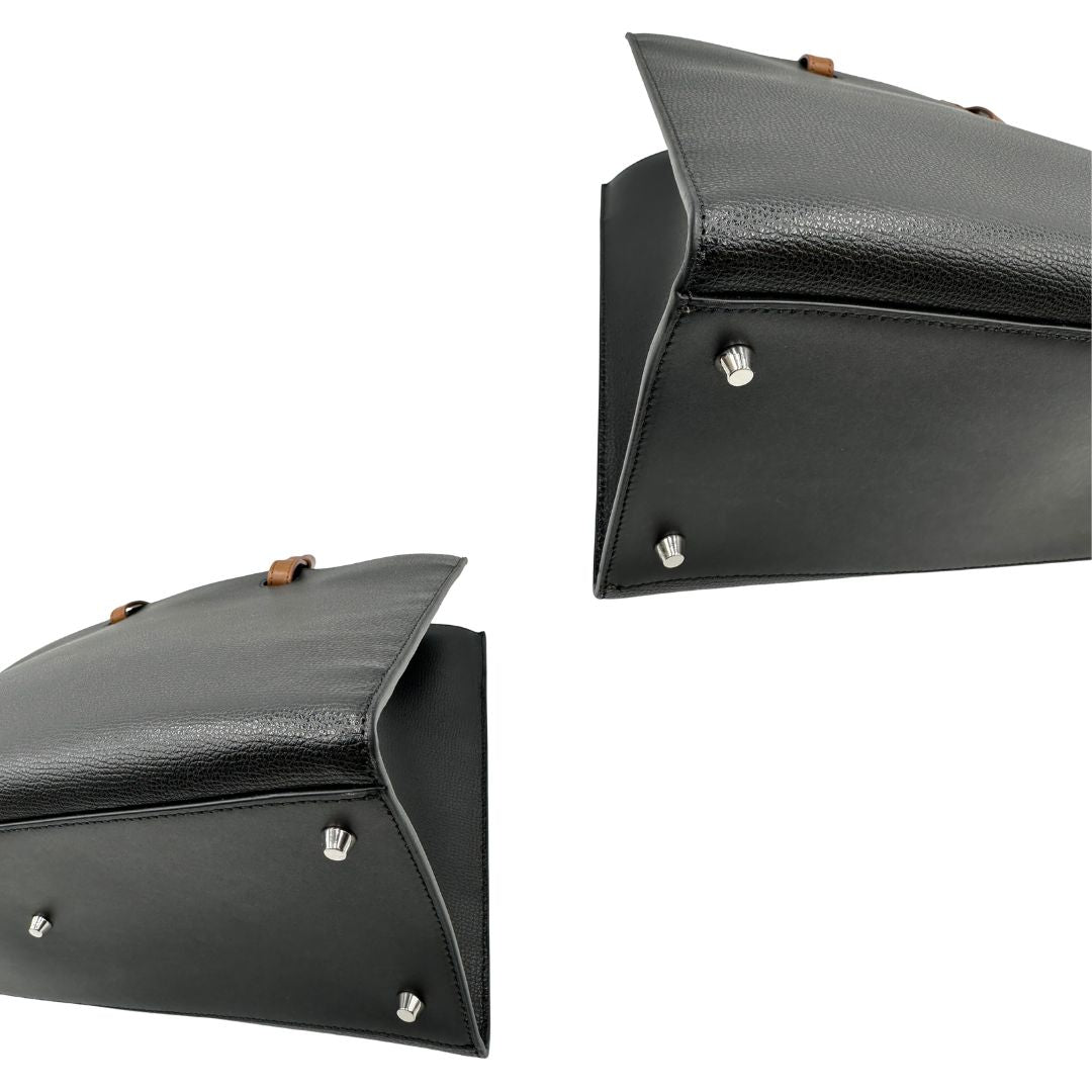 angoli Borsa Furla in pelle nera con logo sul front; munita di doppi manici stondati e doppi manici per poterla portare comodamente a spalla, di lusso, originale, eccellenti condizioni. 