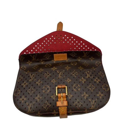 Louis Vuitton pochette Saumur Flore in canvas monogram traforato e finiture in vacchetta naturale, di lusso, originale, ottime condizioni.