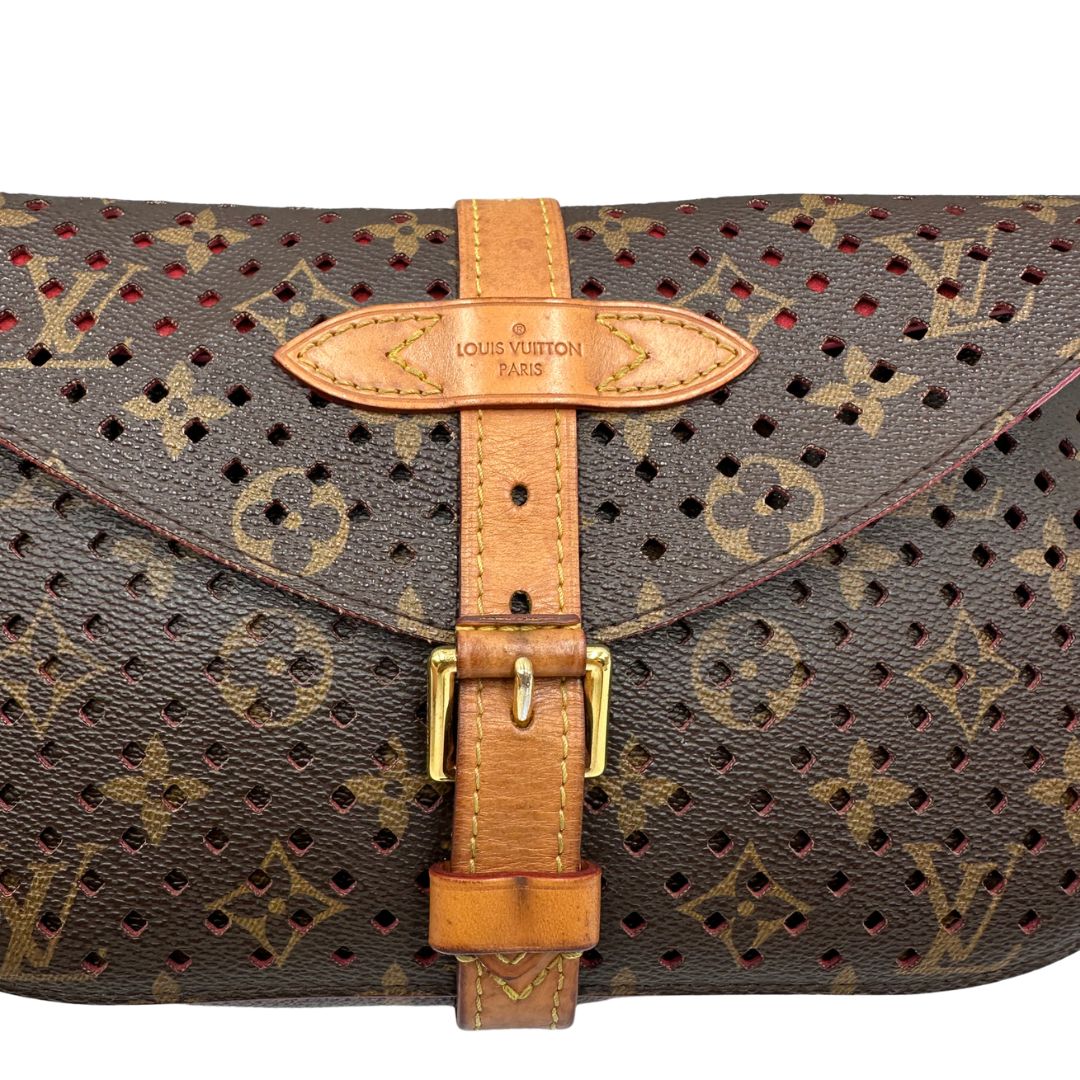 Louis Vuitton pochette Saumur Flore in canvas monogram traforato e finiture in vacchetta naturale, di lusso, originale, ottime condizioni. 