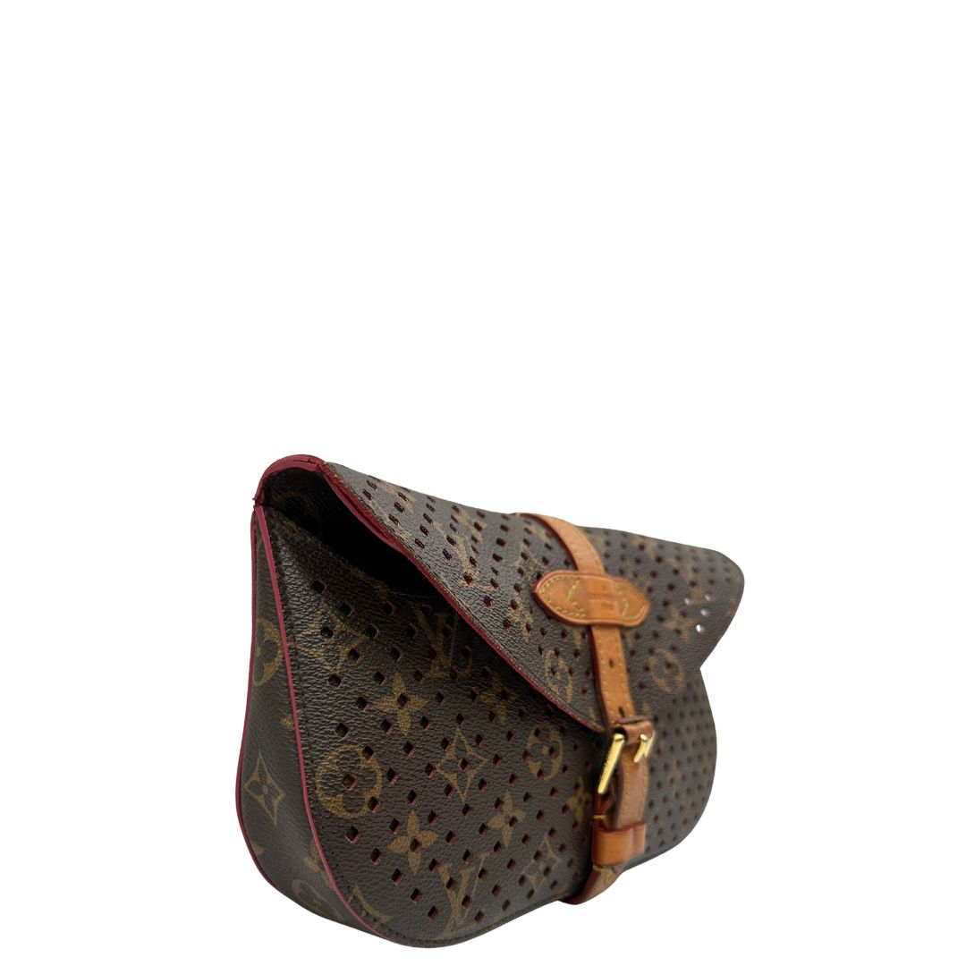 lato Louis Vuitton pochette Saumur Flore in canvas monogram traforato e finiture in vacchetta naturale, di lusso, originale, ottime condizioni.