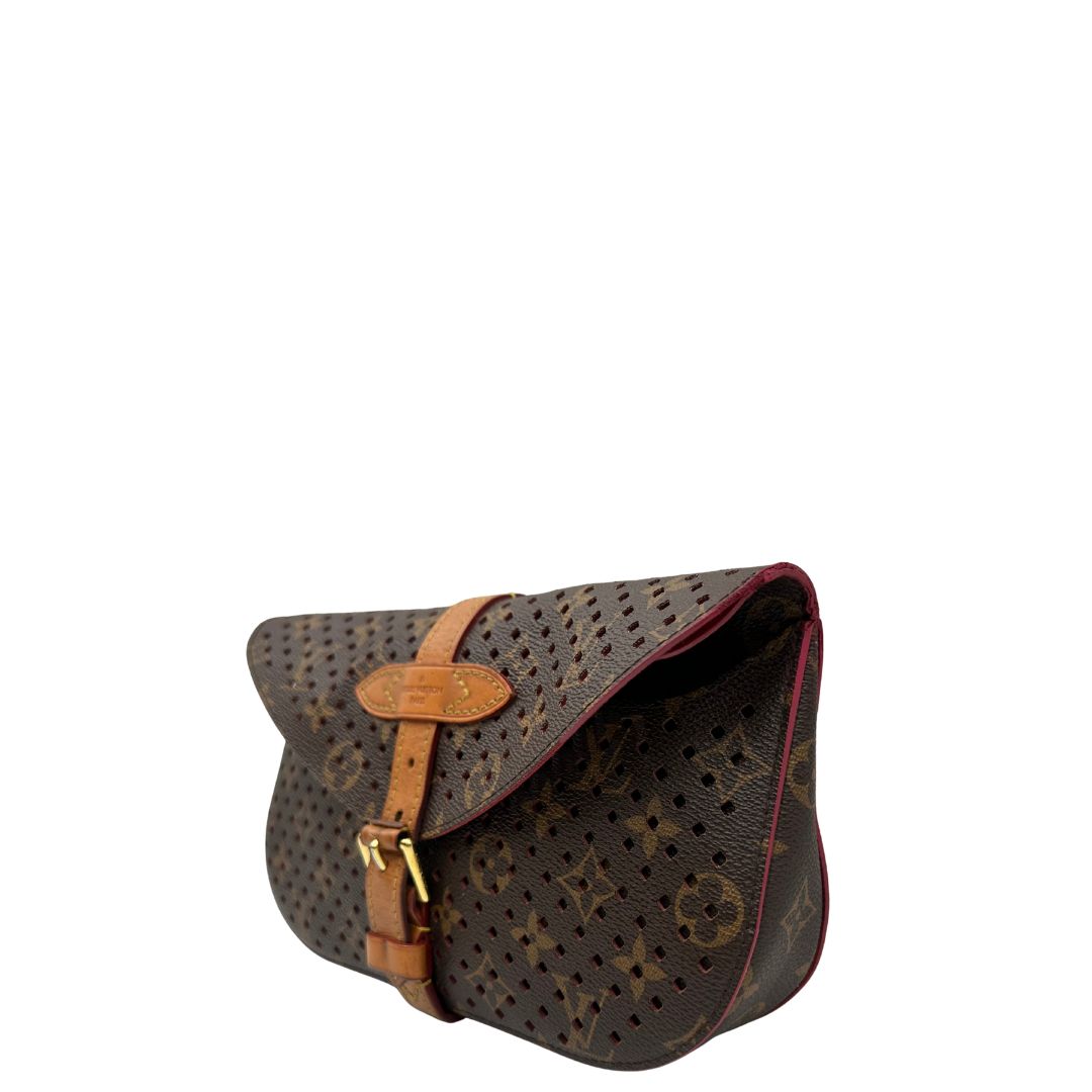lato Louis Vuitton pochette Saumur Flore in canvas monogram traforato e finiture in vacchetta naturale, di lusso, originale, ottime condizioni. 