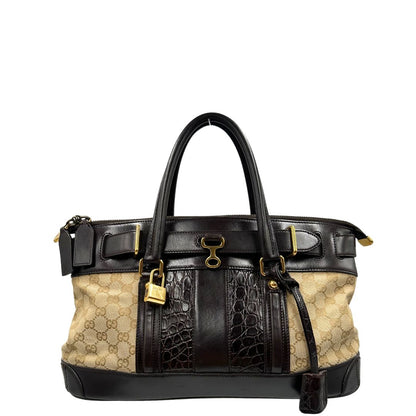 front Borsa Gucci realizzata in tessuto GG e finiture in pelle color testa di moro, di lusso, originale, ottime condizioni, usata. 