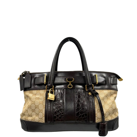 front Borsa Gucci realizzata in tessuto GG e finiture in pelle color testa di moro, di lusso, originale, ottime condizioni, usata. 