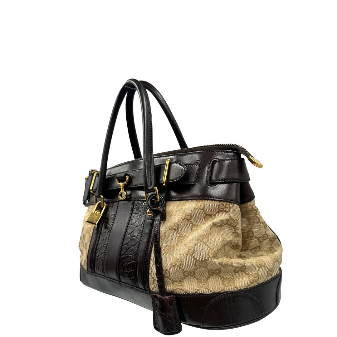 lato Borsa Gucci realizzata in tessuto GG e finiture in pelle color testa di moro, di lusso, originale, ottime condizioni, usata. 