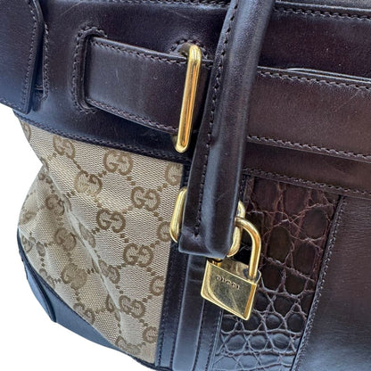 Borsa Gucci realizzata in tessuto GG e finiture in pelle color testa di moro, di lusso, originale, ottime condizioni, usata.