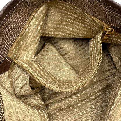  Borsa Prada in tessuto Jacquard munita di doppi manici in pelle marrone, di lusso, originale, ottime condizioni, usata.