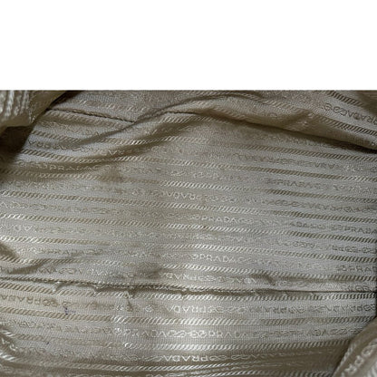  Borsa Prada in tessuto Jacquard munita di doppi manici in pelle marrone, di lusso, originale, ottime condizioni, usata.